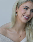 Brass teardrop necklace on model – Irish handmade jewellery