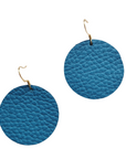 Grian leather earrings in bold blue – circular lightweight earrings with gold hooks on a plain white background