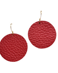 Grian leather earrings in rich red – circular statement earrings with gold hooks on a white background