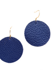 Grian leather earrings in royal blue – circular lightweight earrings with gold hooks photographed on a plain white background