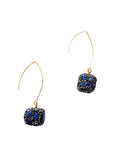 Close-up of lapis lazuli cube earrings with pavé crystals