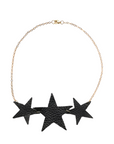 Réalt Star Necklace in black leather with three statement stars and a gold chain, laid flat on a white background