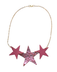 Réalt Star Necklace in pink metallic leather with three bold stars and a gold chain, laid flat on a white background
