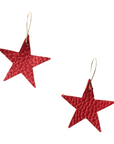 Pair of rich red leather star earrings with visible grain texture and gold-plated hooks, shown against a white background