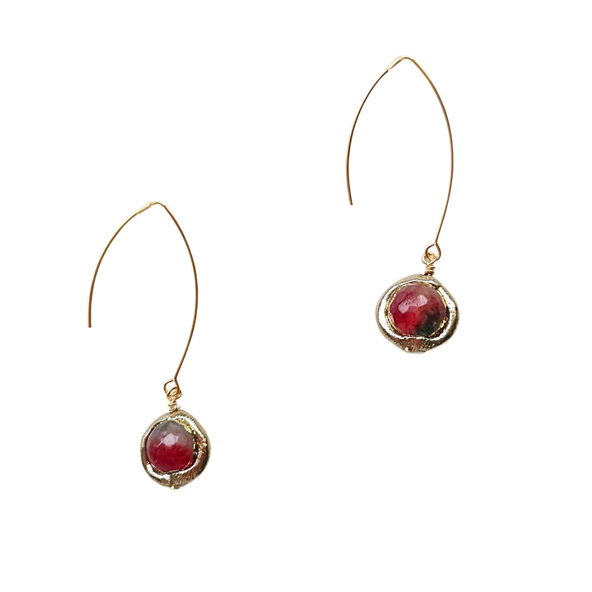 Close-up of faceted agate earrings in red a