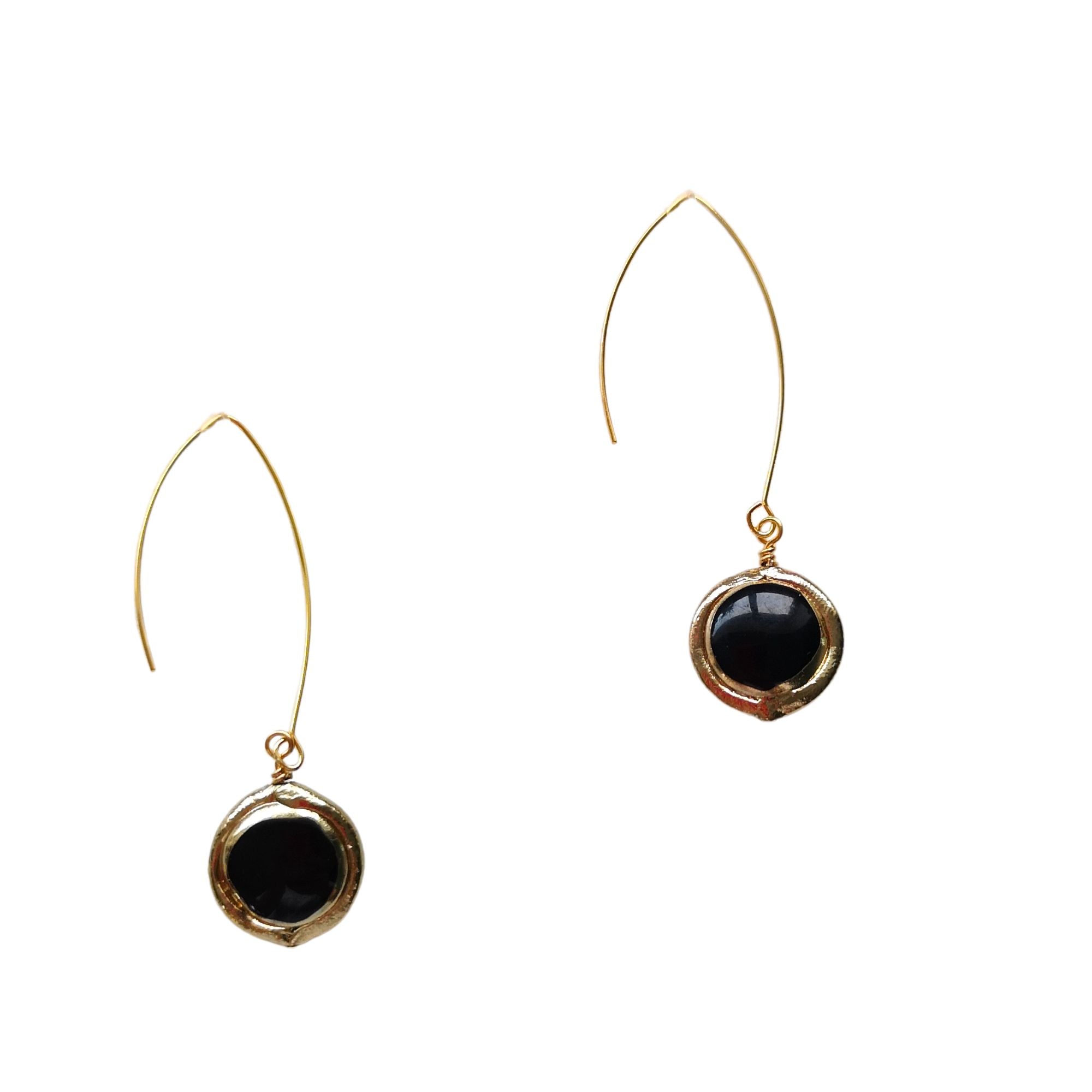 Close-up of lightweight coin earrings in  black