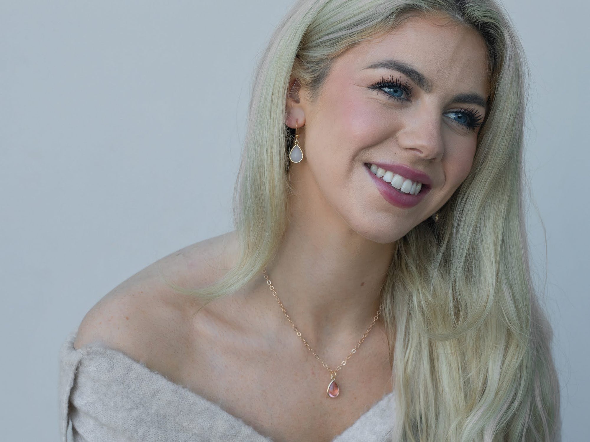 Brass teardrop necklace on model – Irish handmade jewellery