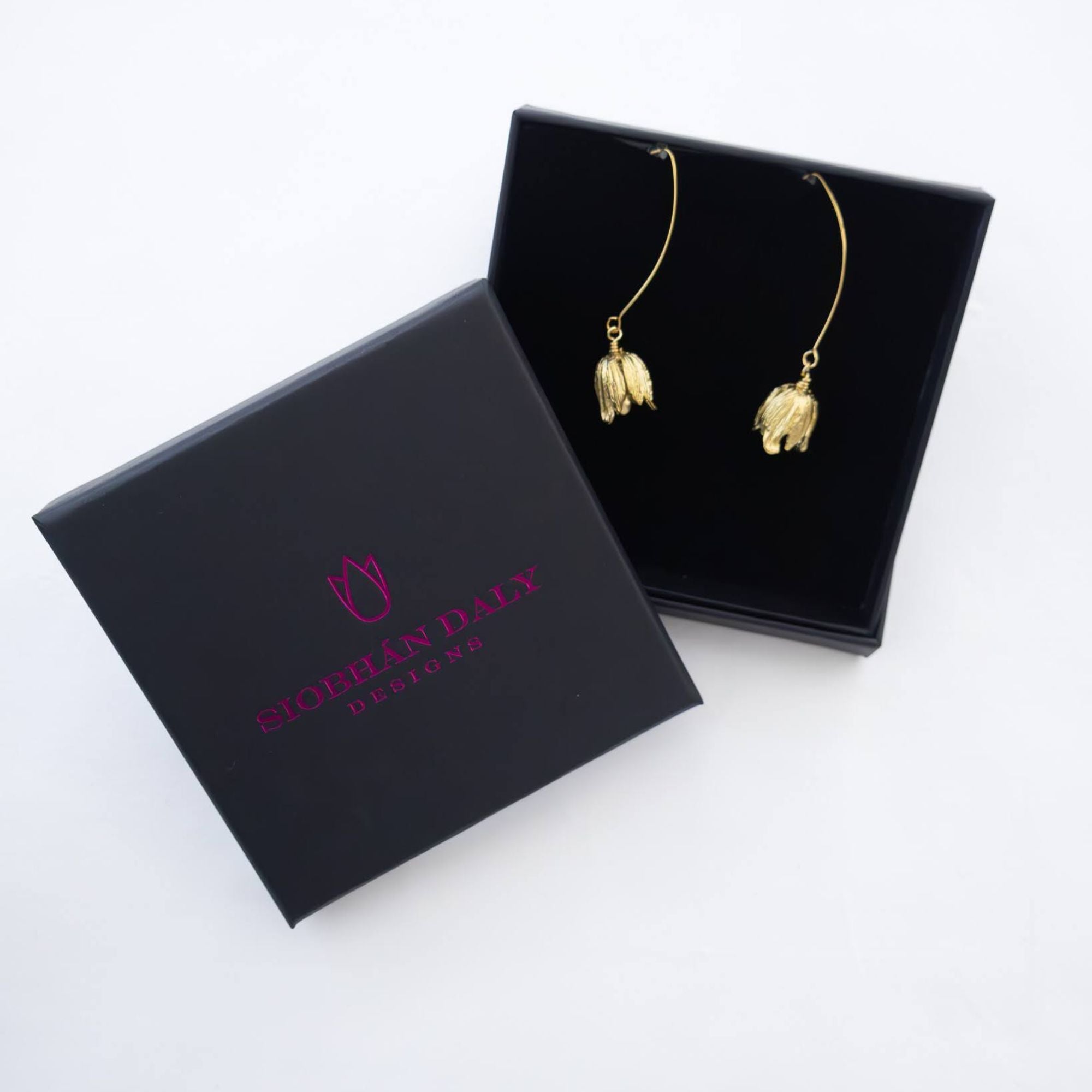 Delicate petal-shaped brass earrings inspired by nature