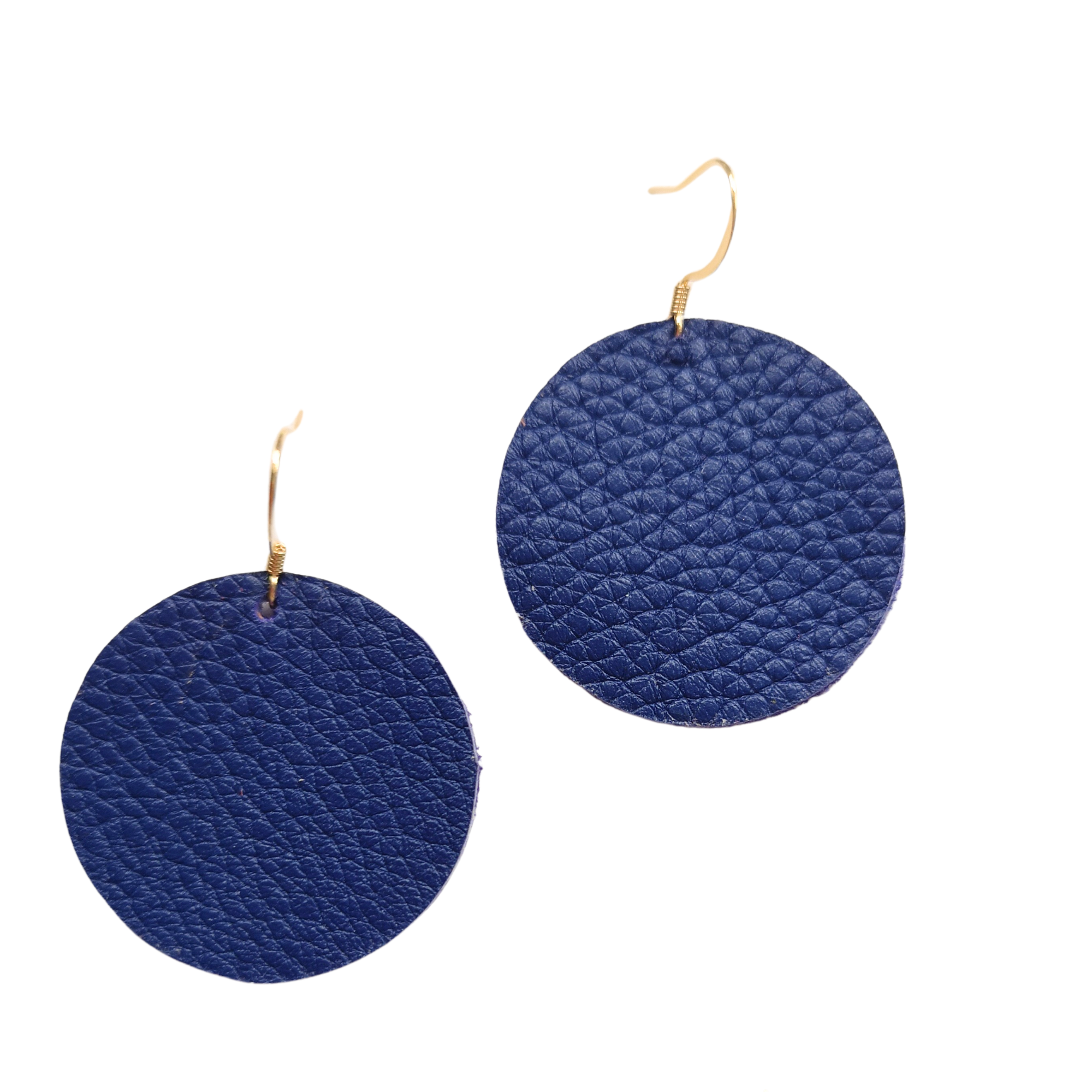 Grian leather earrings in royal blue – circular lightweight earrings with gold hooks photographed on a plain white background