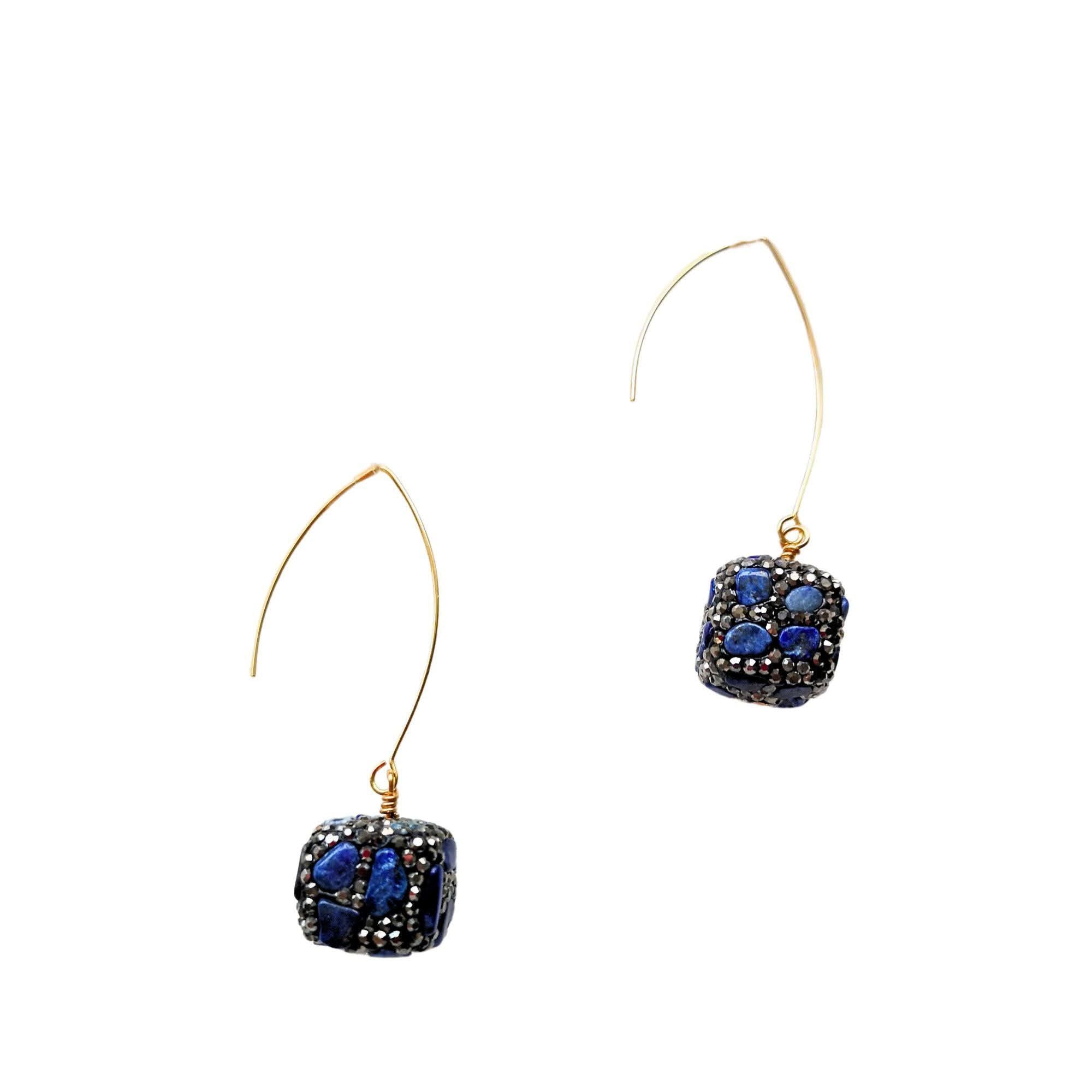 Close-up of lapis lazuli cube earrings with pavé crystals