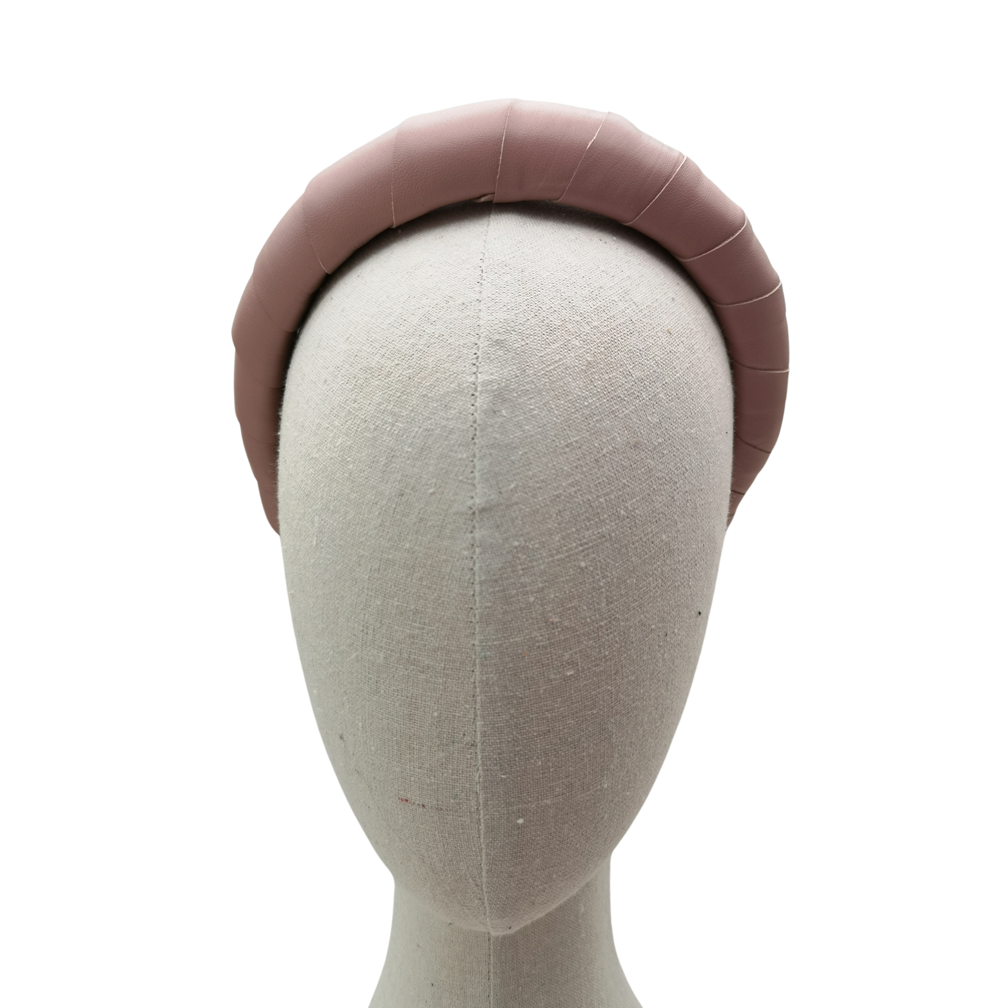Dusky pink padded satin headband displayed on a neutral mannequin head against a white background