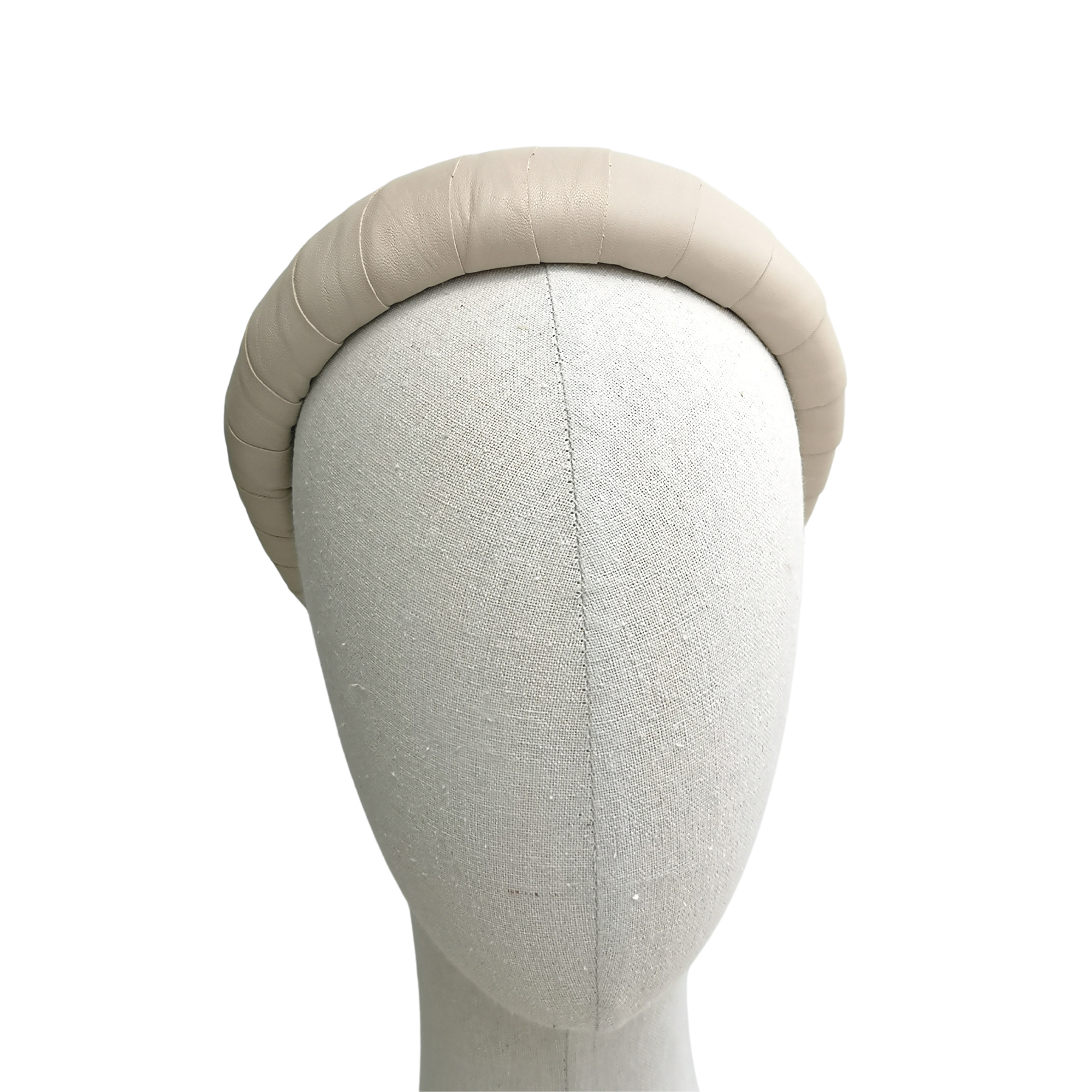 Ivory satin-look padded headband displayed on a neutral mannequin head against a white background