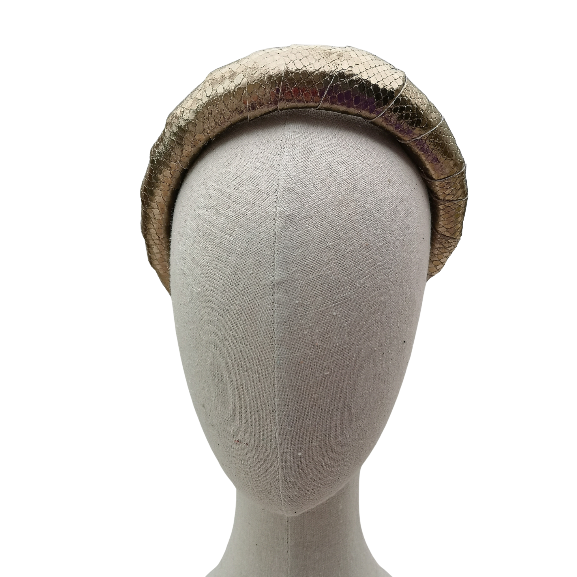 Gold textured leather-look padded headband displayed on a neutral mannequin head against a white background