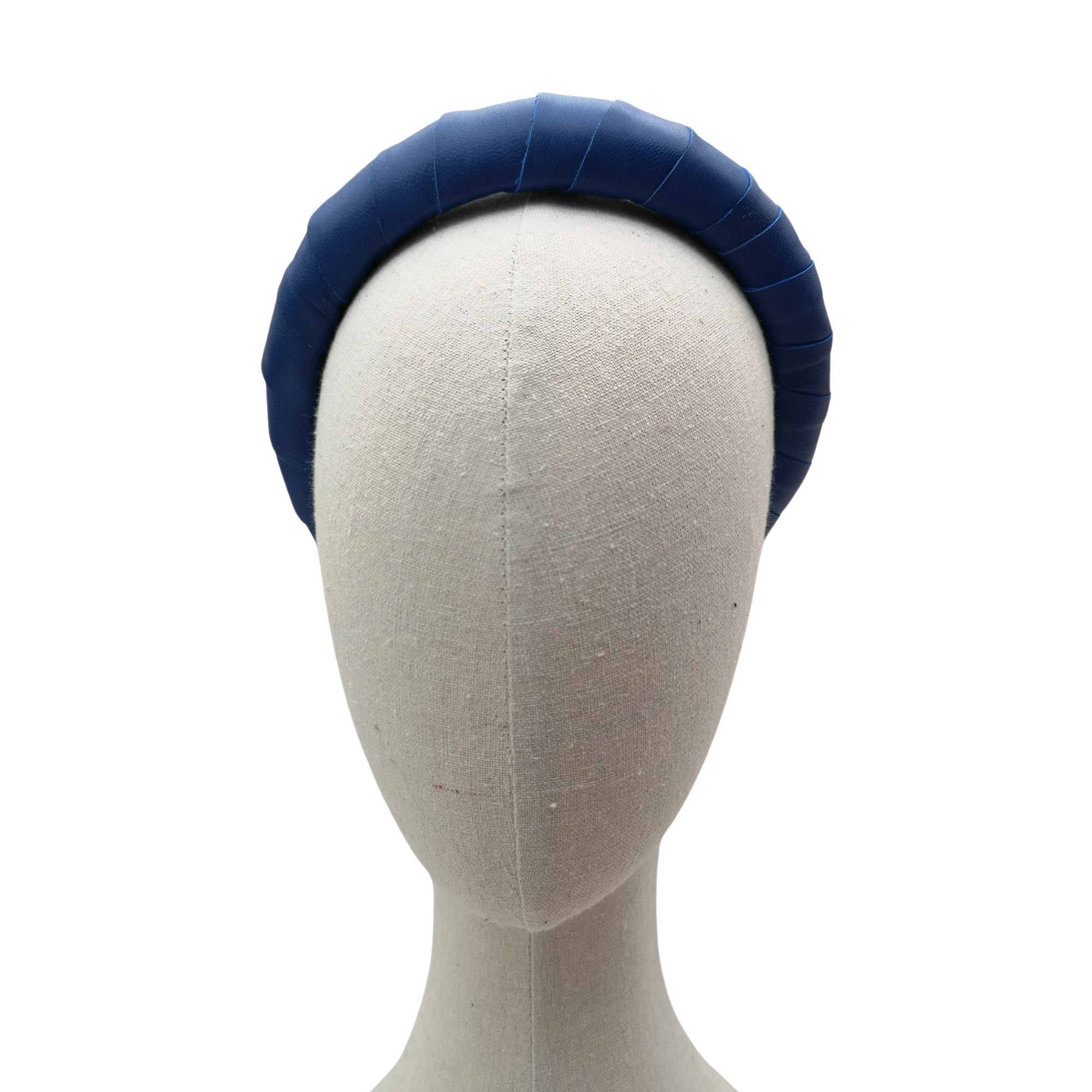 Navy blue padded satin headband displayed on a neutral-toned mannequin head against a white background