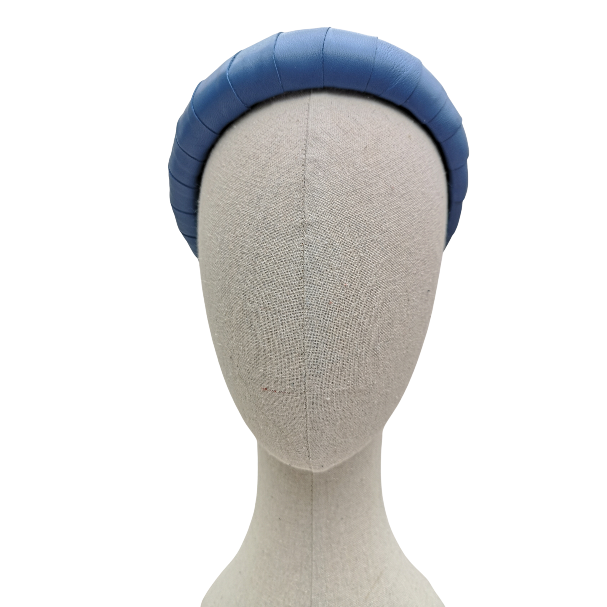 Sky blue padded satin headband displayed on a neutral-toned mannequin head against a white background